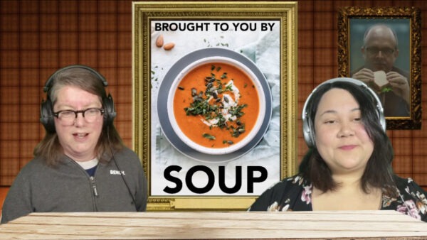 Katrina and Jen at a desk in front of an image of orange soup with the words "Brought to you by Soup" in the image next to the soup.